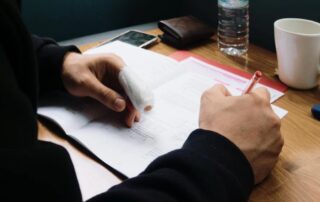 an employee with an injured finger filing a complaint using a pen