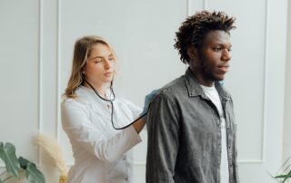 A doctor performing a medical evaluation