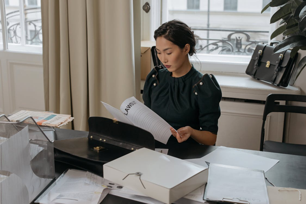 A woman reading legal documents