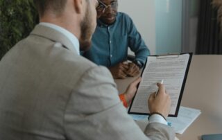 Man reading a legal contract at his desk