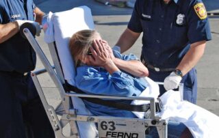 Woman receiving first aid after a workplace accident