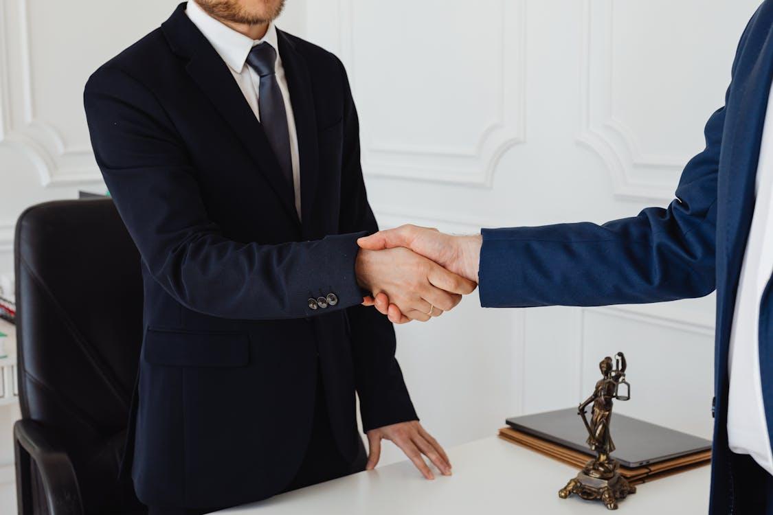 a client and attorney shaking hands