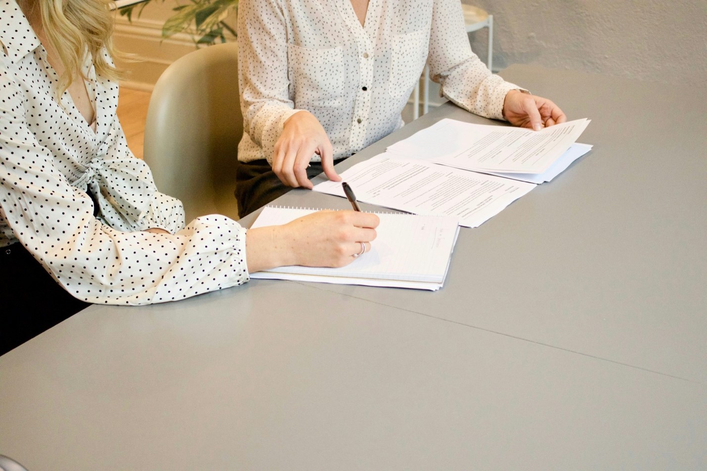 Professional team collaborating and reviewing documents for a workers’ compensation claim appeal
