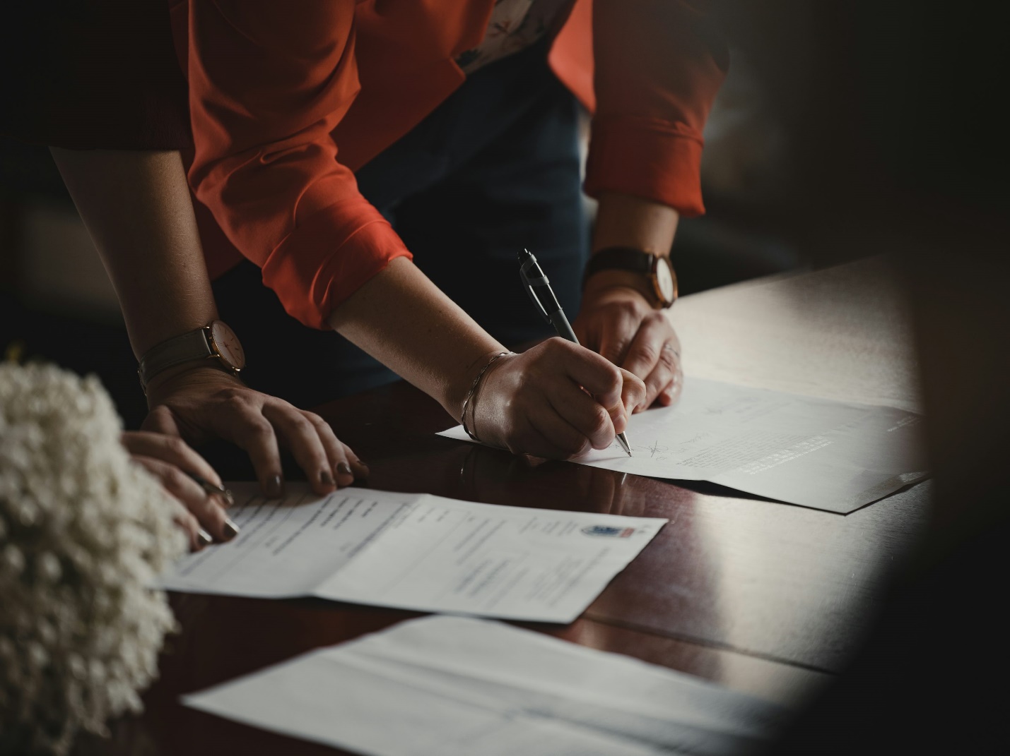 Workers' compensation lawyer reviewing workplace injury documents during a consultation with an injured employee.