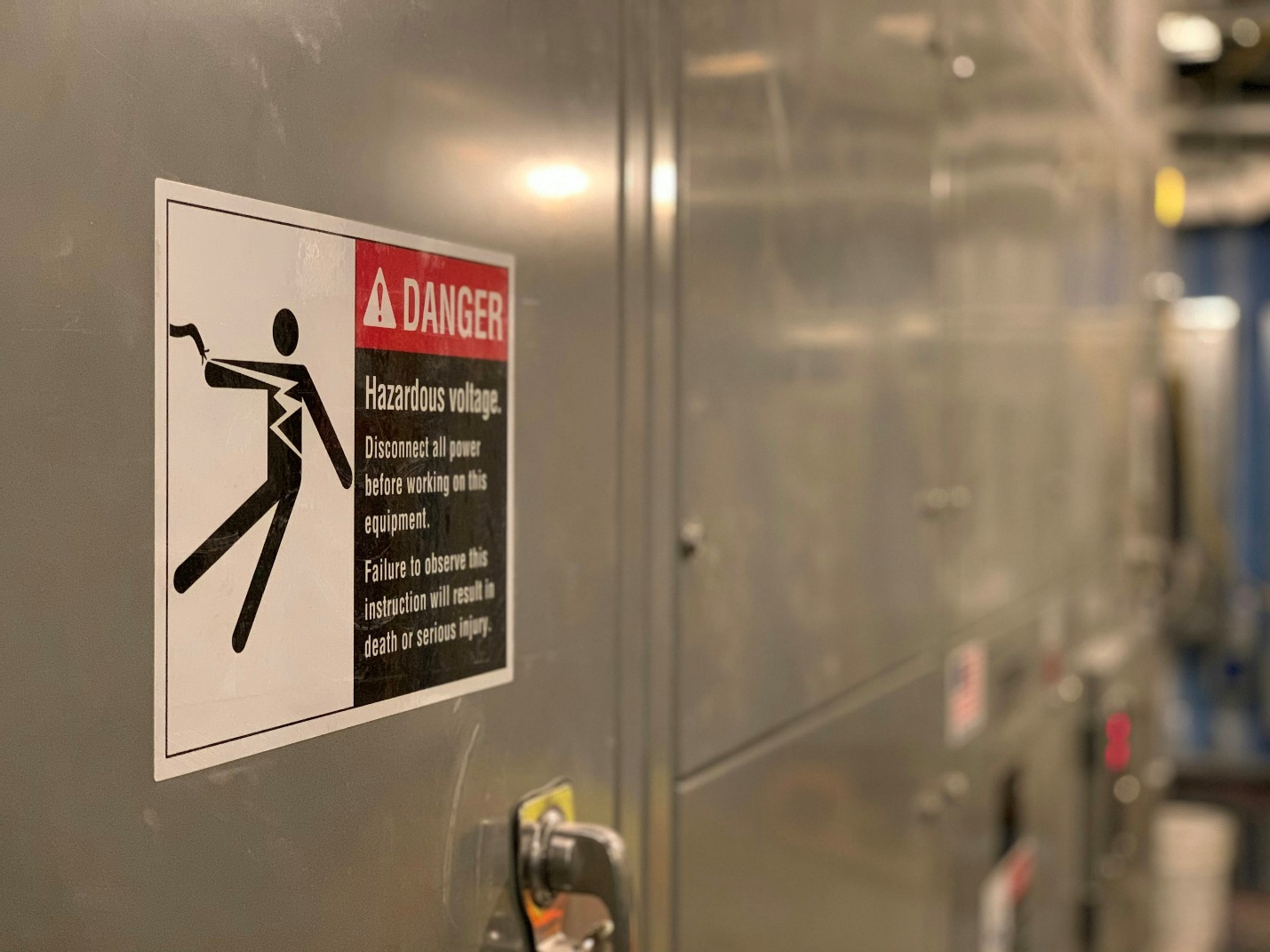 Workplace safety signs displayed at an industrial facility reminding employees to follow established safety protocols.