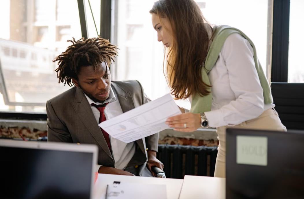 Professional discussing a workplace injury claim with an injured employee.