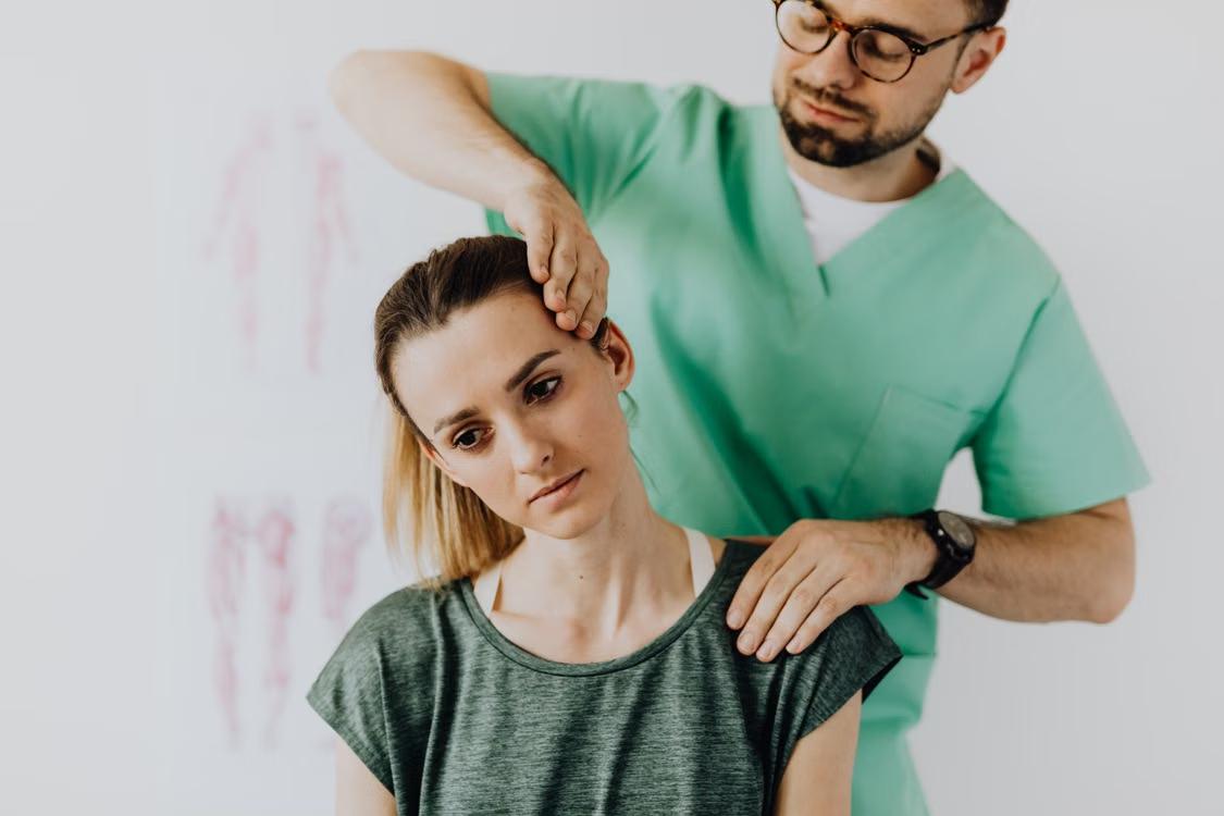 An image of a woman getting physiotherapy for a neck injury