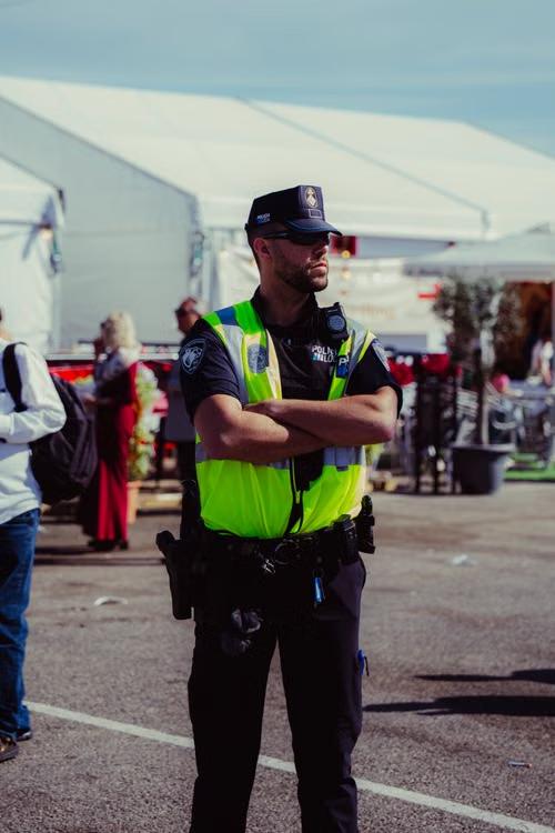 An image of a police officer standing at an event
