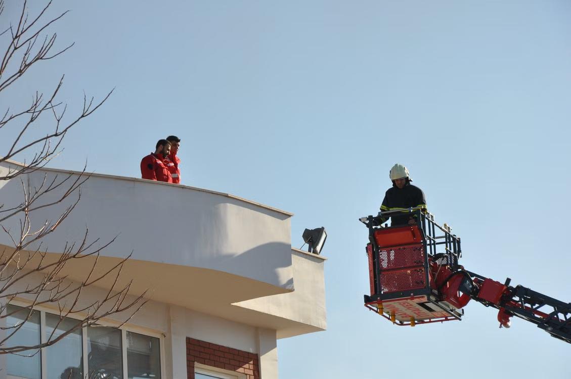 An image of a worker on a crane
